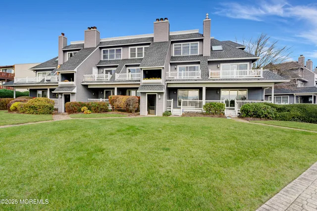 an aerial view of a chairs and table with wooden floor