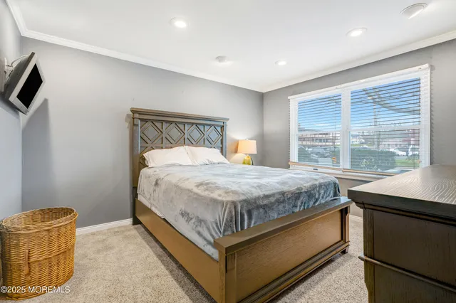 an aerial view of a house with outdoor seating