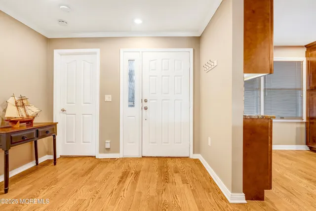 a kitchen with stainless steel appliances granite countertop a sink a stove and a refrigerator