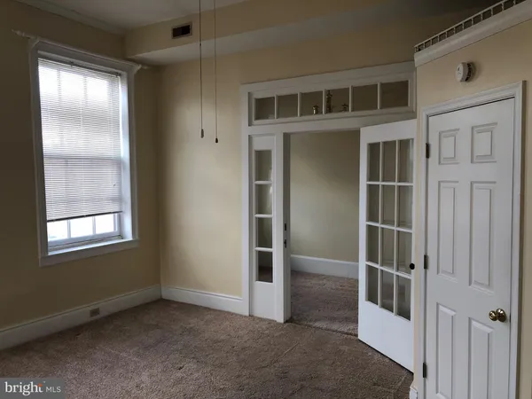 a view of an empty room with a window
