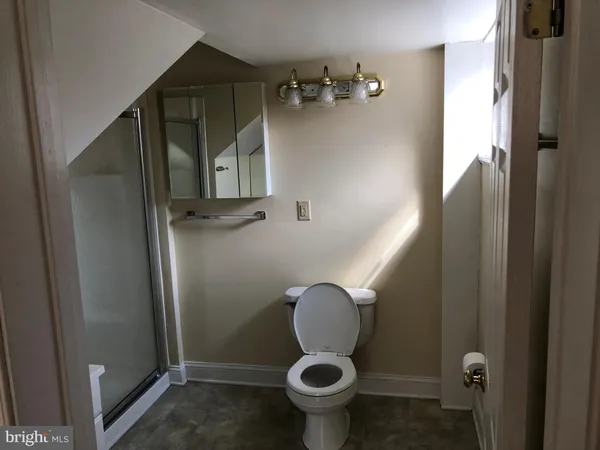 a bathroom with a sink and toilet