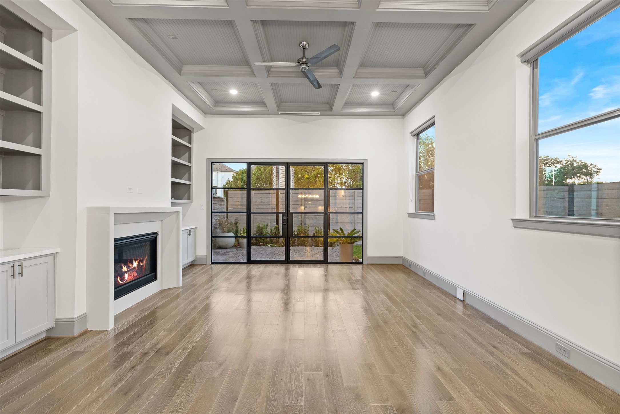 1719 Holman Street Houston, TX 77004 - Photo 11 of 40 a view of an empty room with a fireplace and a window