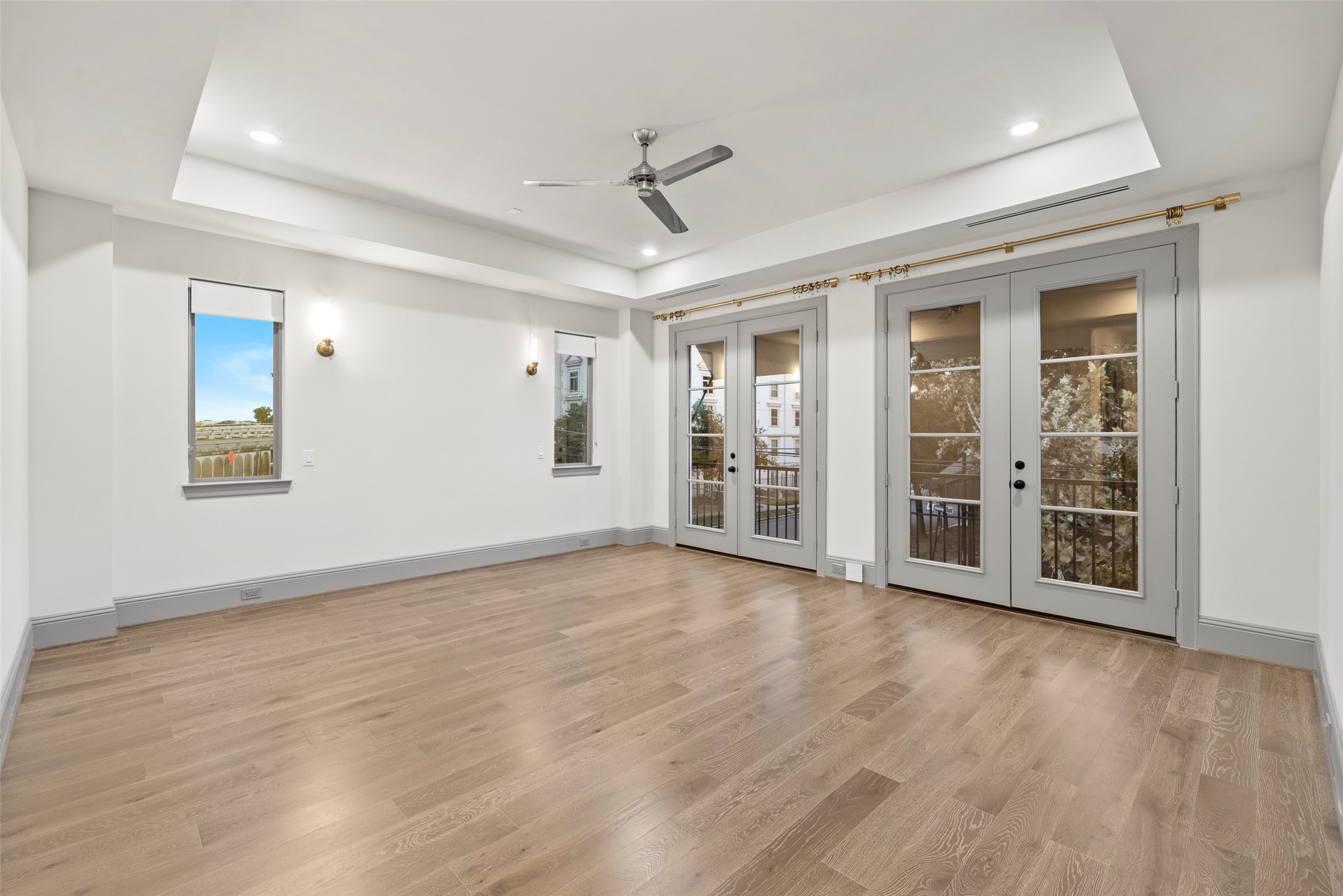 1719 Holman Street Houston, TX 77004 - Photo 17 of 40 a view of an empty room with a window and wooden floor