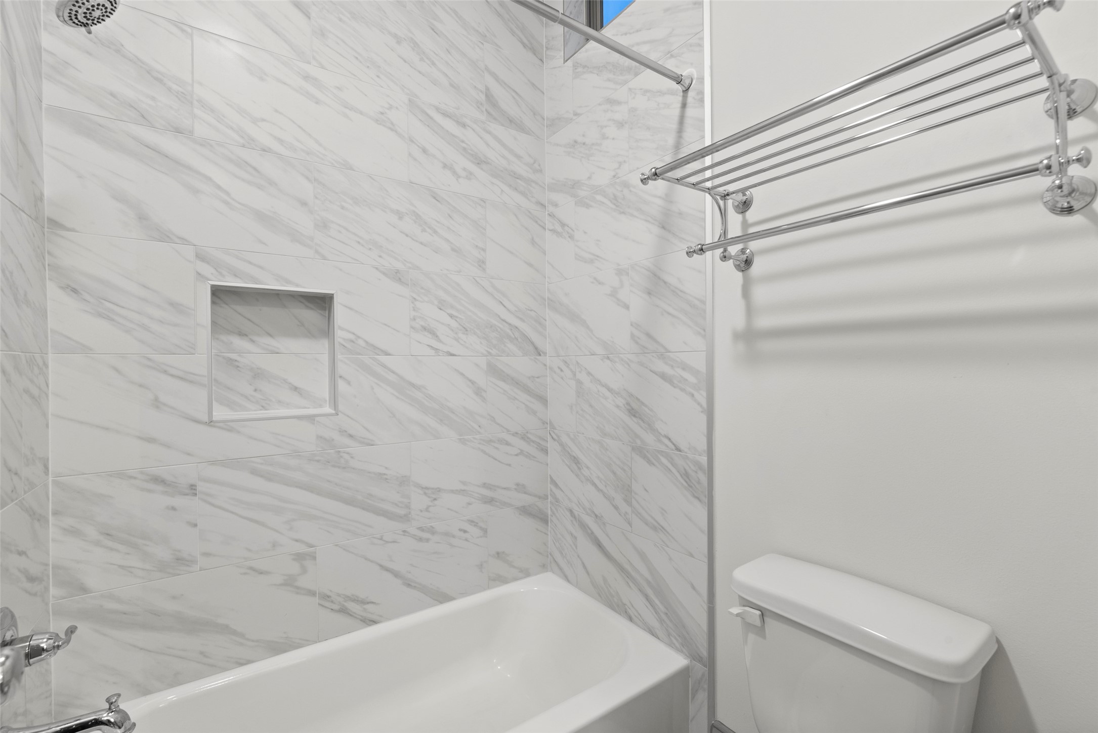 1719 Holman Street Houston, TX 77004 - Photo 23 of 40 a bathroom with a white toilet and a bathtub