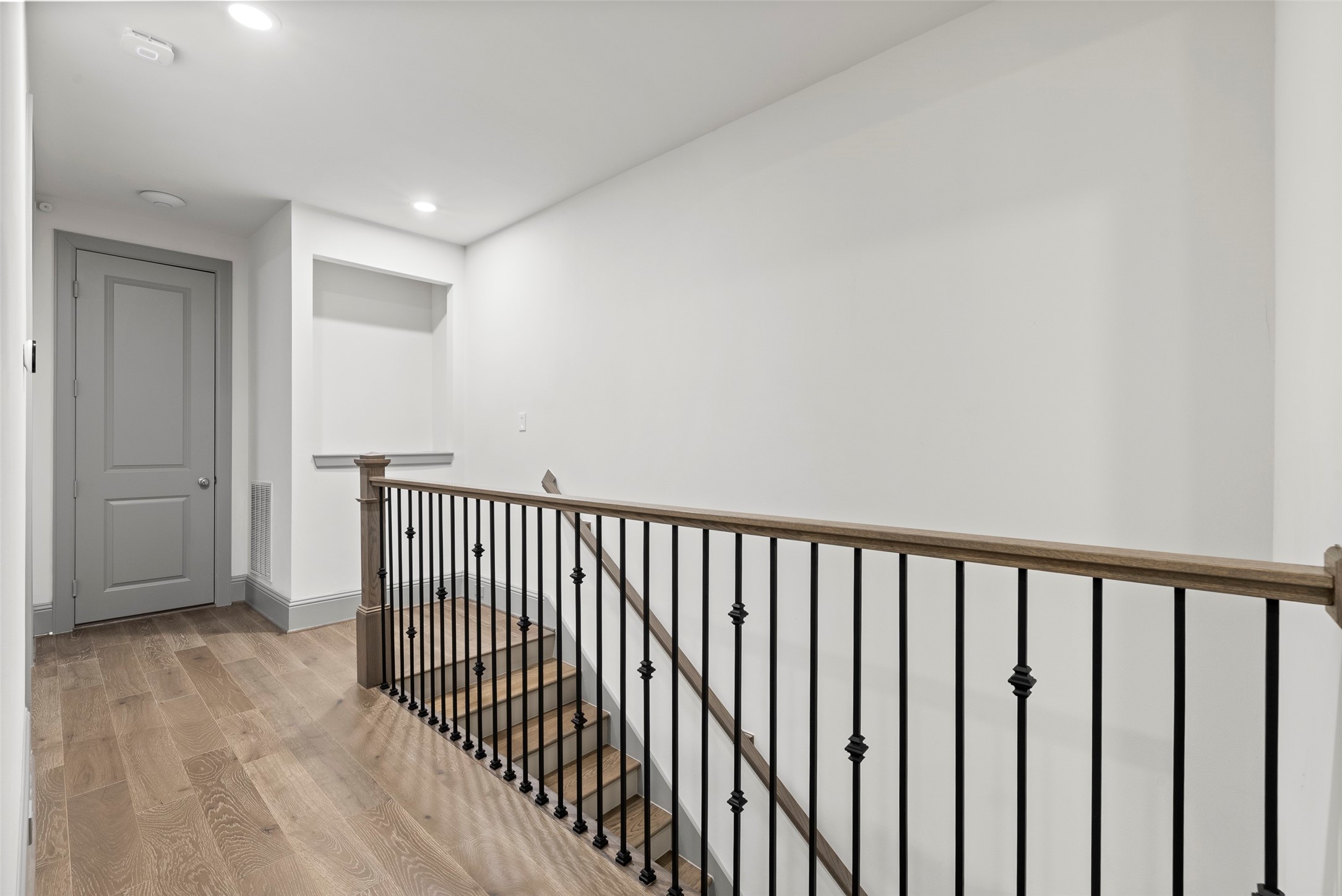 1719 Holman Street Houston, TX 77004 - Photo 31 of 40 a view of a hallway with wooden floor