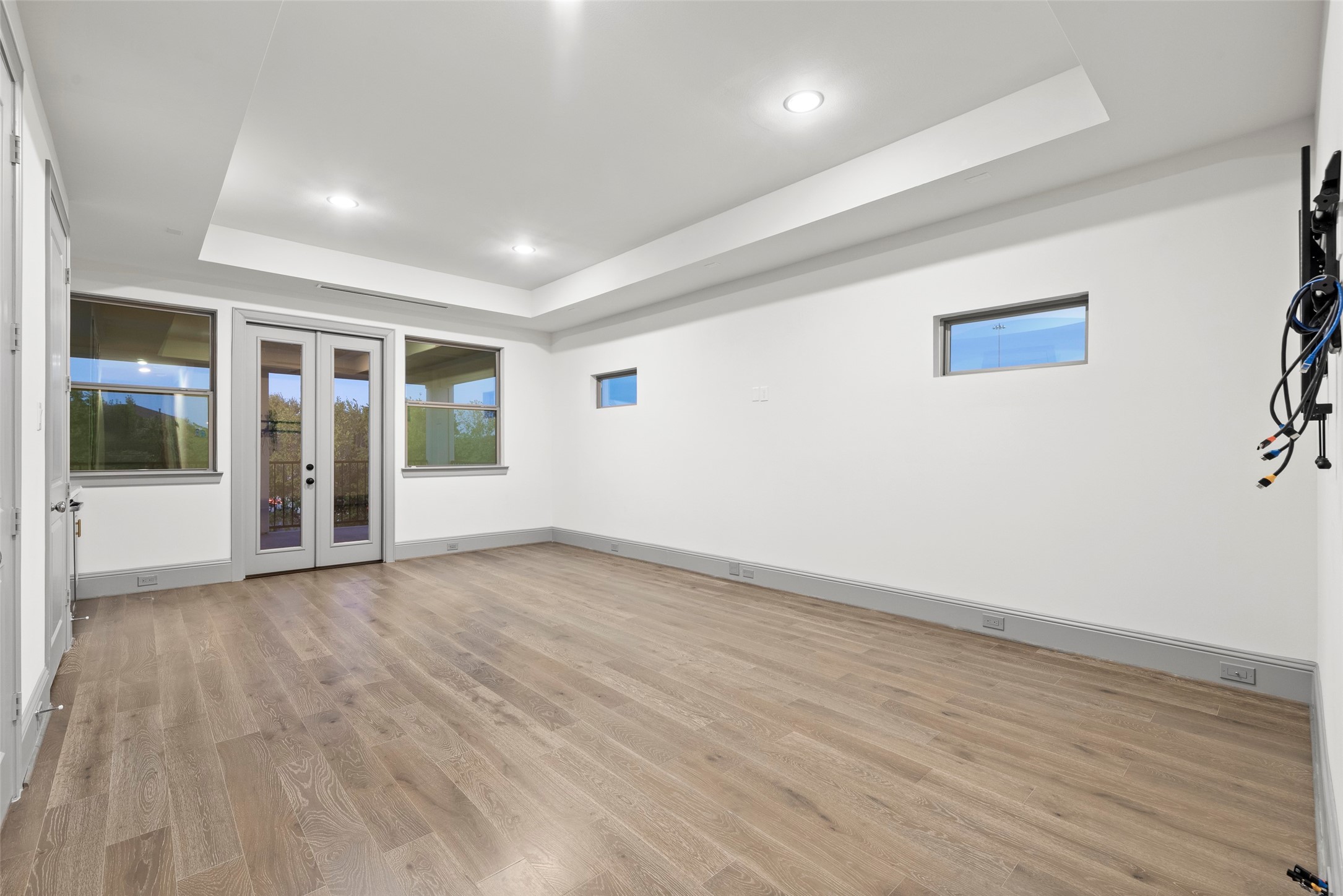 1719 Holman Street Houston, TX 77004 - Photo 32 of 40 an empty room with wooden floor and windows