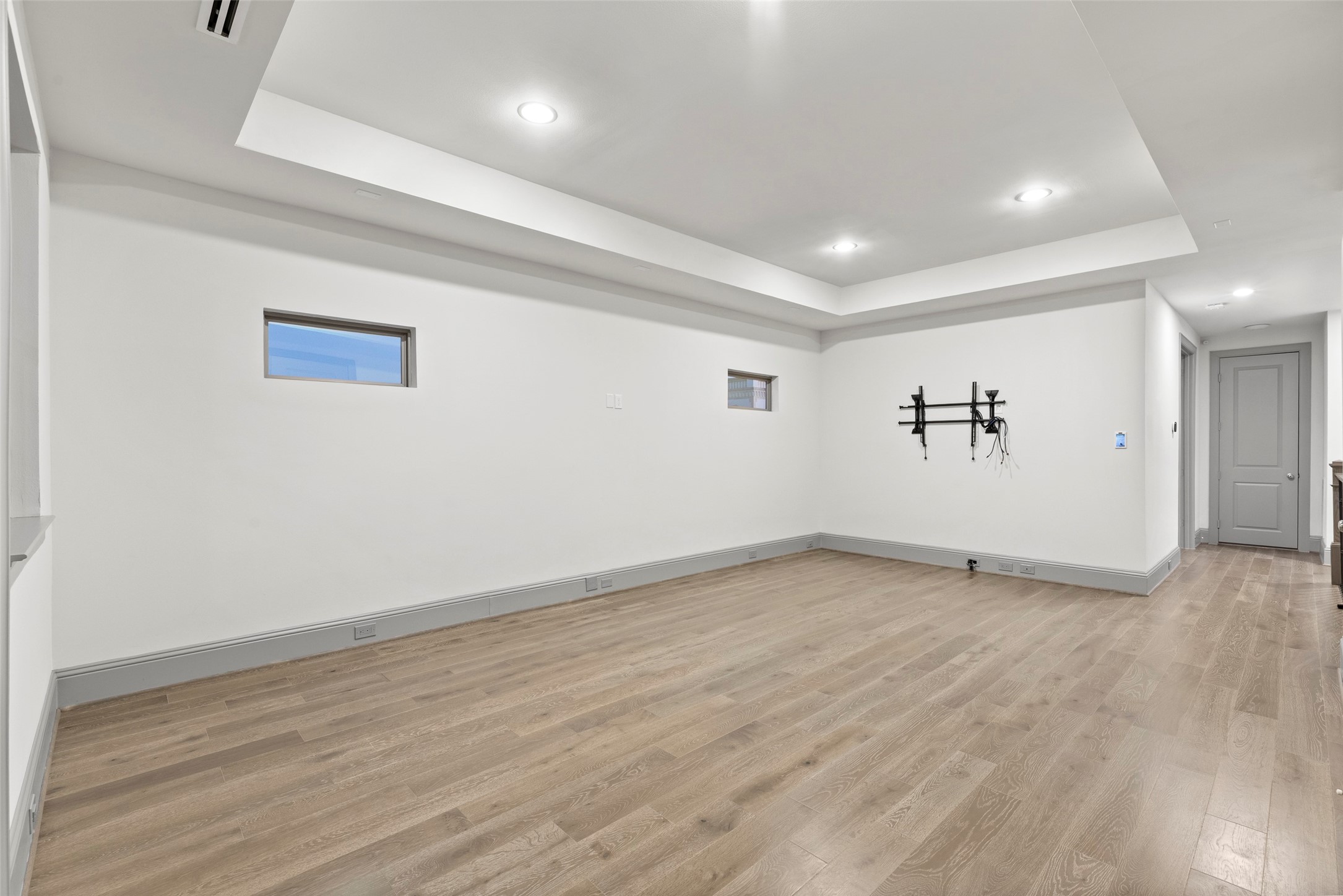 1719 Holman Street Houston, TX 77004 - Photo 33 of 40 an empty room with wooden floor and windows