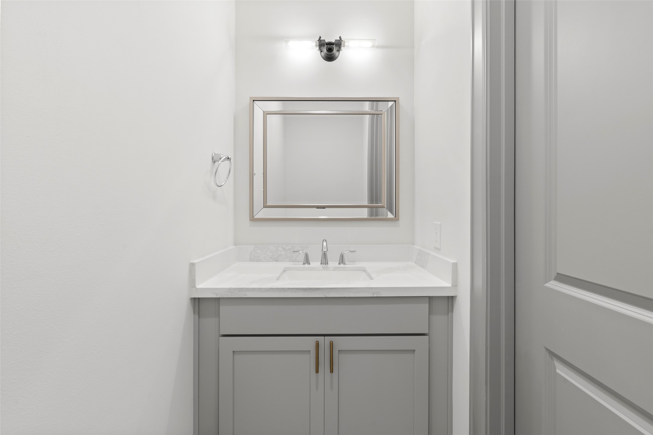 1719 Holman Street Houston, TX 77004 - Photo 35 of 40 a bathroom with a sink and a mirror