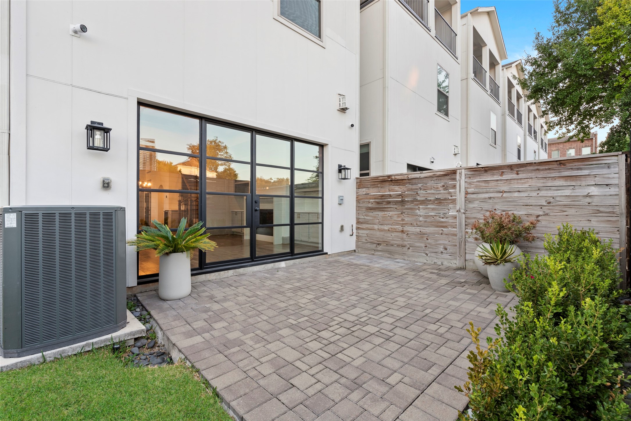 1719 Holman Street Houston, TX 77004 - Photo 39 of 40 a view of entryway with flower plants