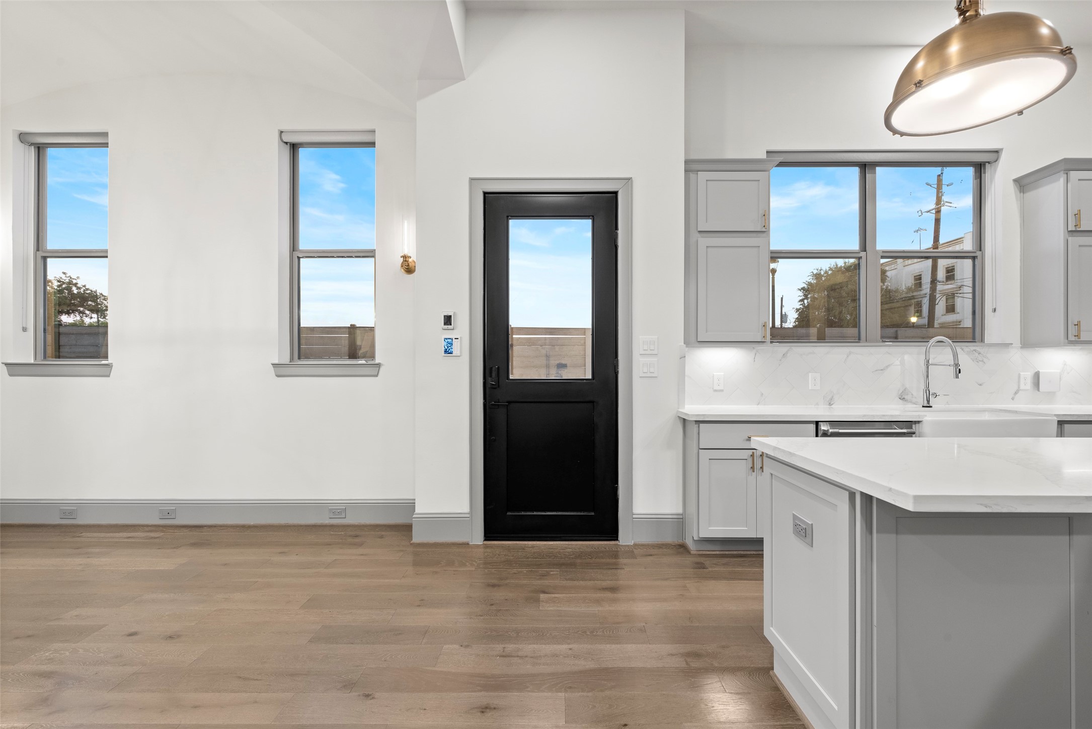 1719 Holman Street Houston, TX 77004 - Photo 6 of 40 a kitchen with a sink cabinets and a wooden floor