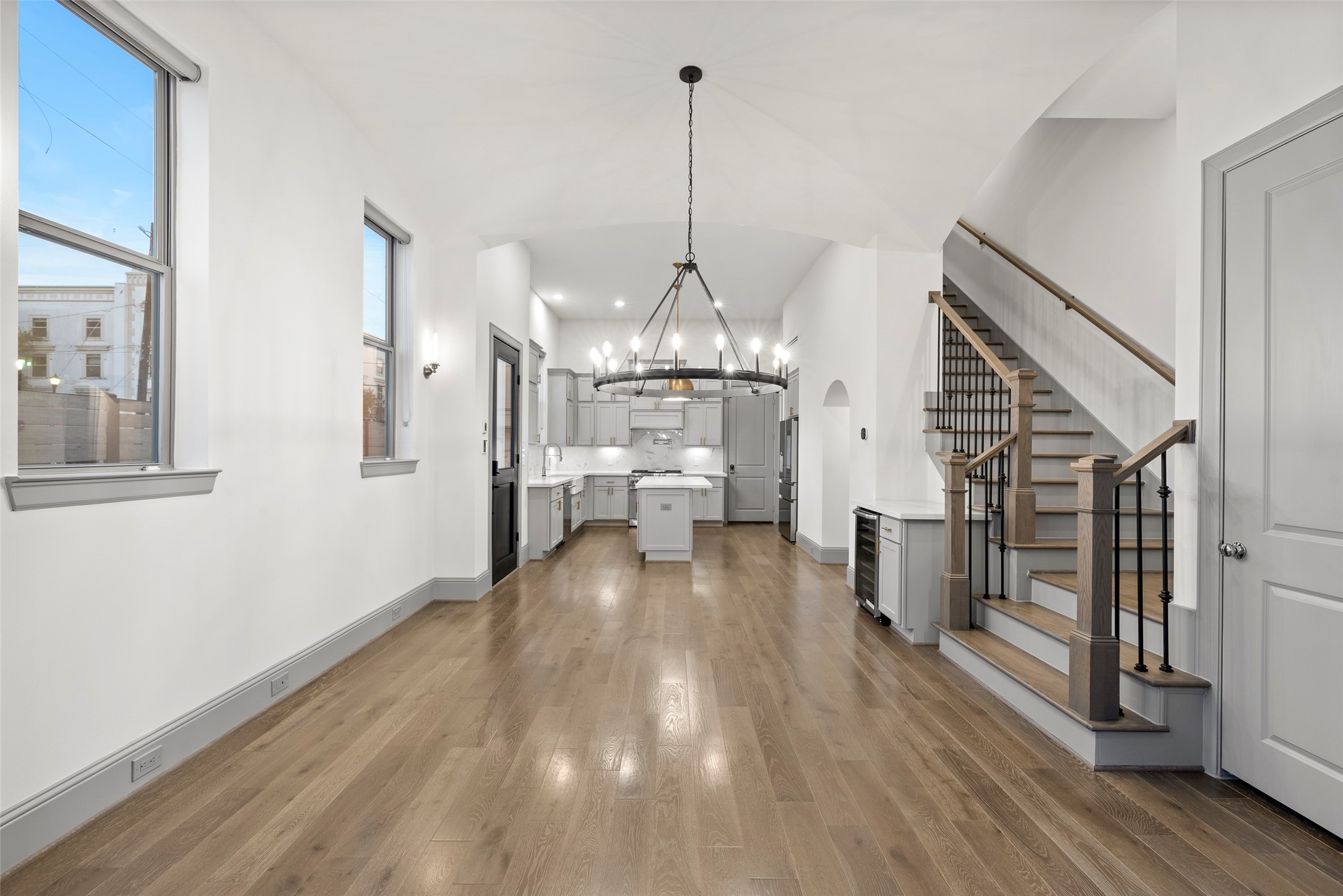 1719 Holman Street Houston, TX 77004 - Photo 10 of 40 a view of an empty room and wooden floor kitchen view