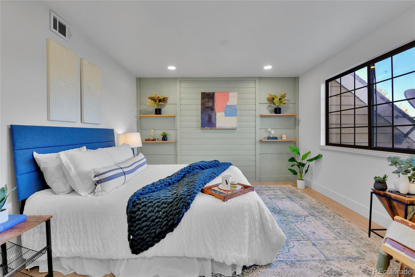 4878 East Kentucky Avenue, Unit E Denver, CO 80246 - Photo 11 of 19 a bedroom with a large bed and a potted plant