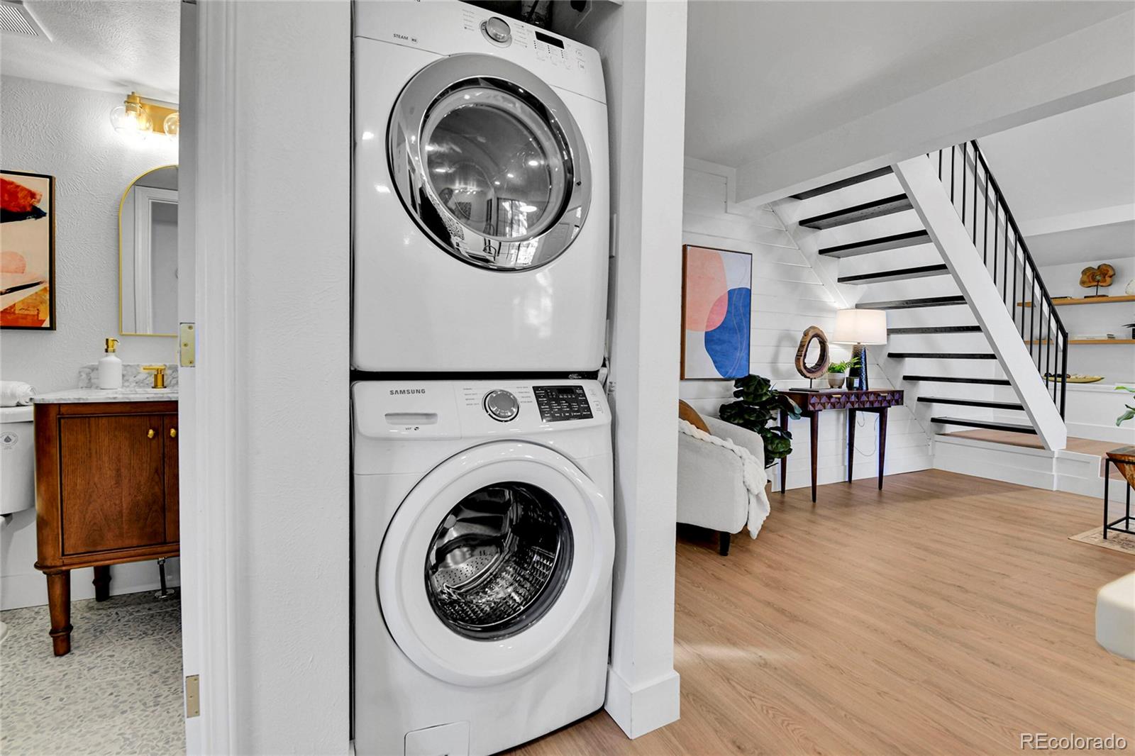 4878 East Kentucky Avenue, Unit E Denver, CO 80246 - Photo 17 of 19 a view of a hallway with washer and dryer