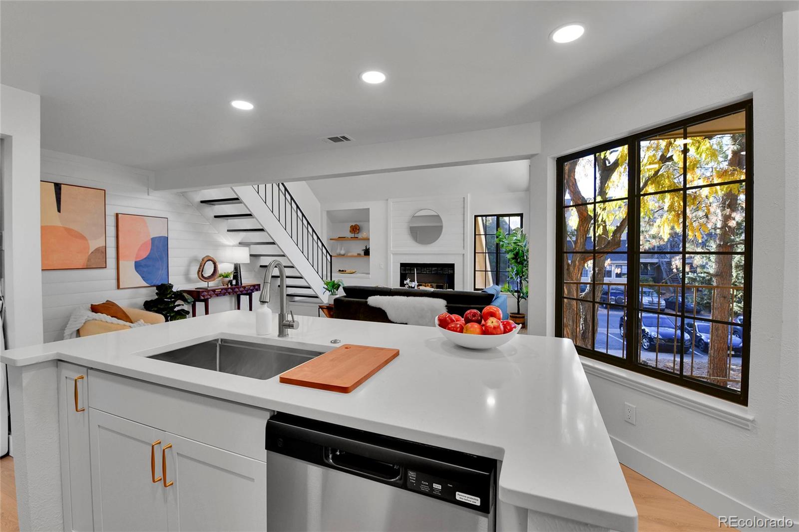 4878 East Kentucky Avenue, Unit E Denver, CO 80246 - Photo 7 of 19 a view of a kitchen area with furniture and a large window
