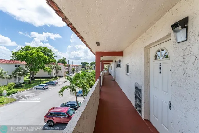 a room with pool table and chairs