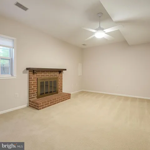 an empty room with a fireplace