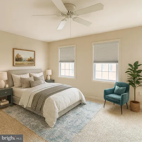 a bedroom with a bed a couch and a potted plant