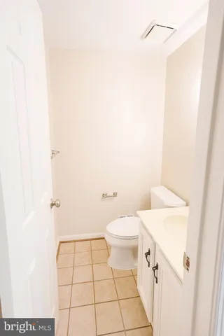 a bathroom with a sink a toilet and a shower