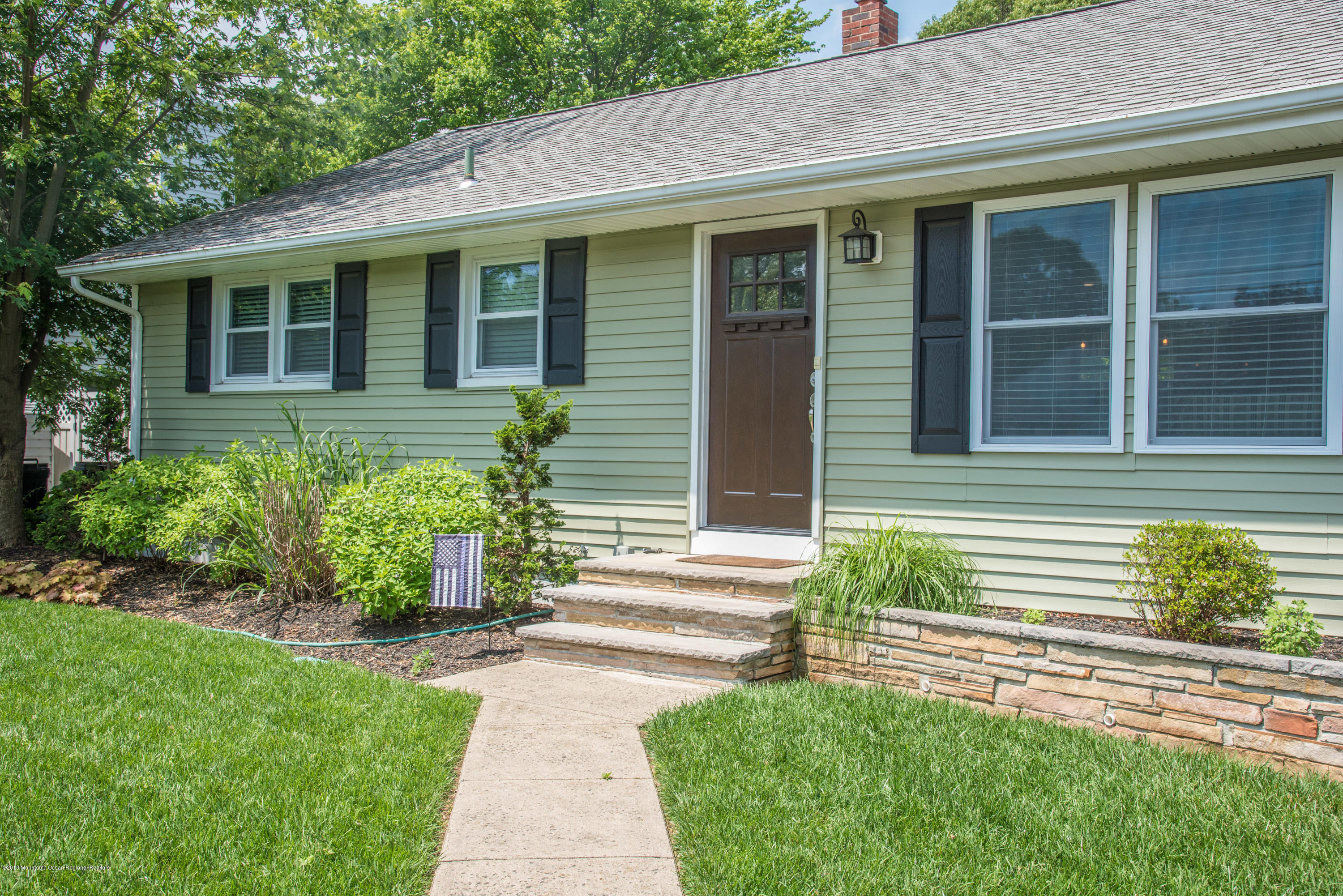 813 Beaver Dam Road Point Pleasant, NJ 08742 - Photo 1 of 27 a front view of a house with a yard