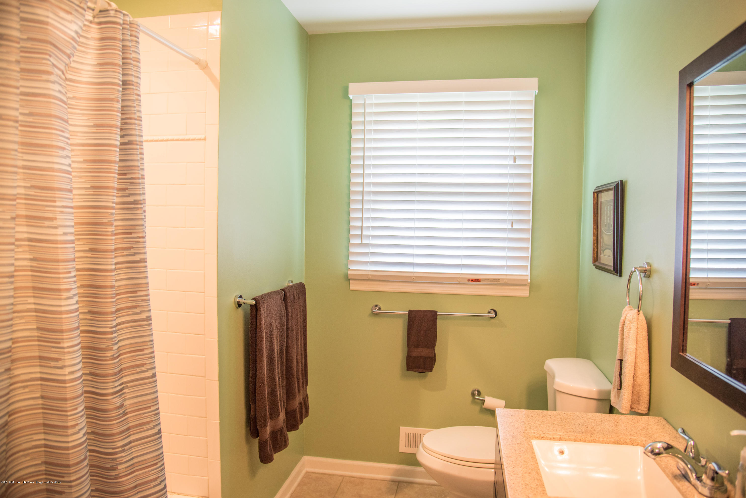 813 Beaver Dam Road Point Pleasant, NJ 08742 - Photo 13 of 27 a bathroom with a sink toilet and shower