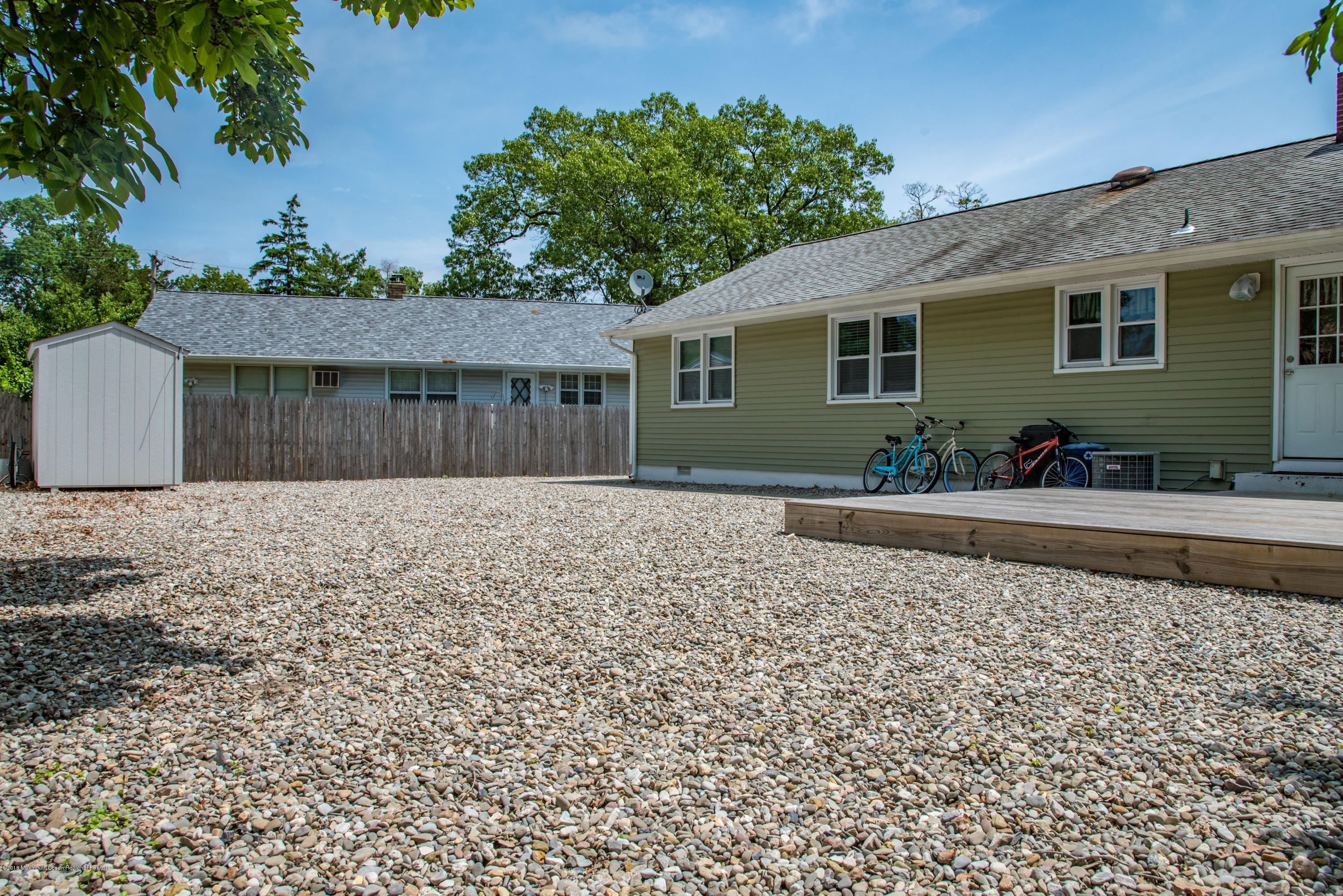 813 Beaver Dam Road Point Pleasant, NJ 08742 - Photo 25 of 27 a front view of a house with garden