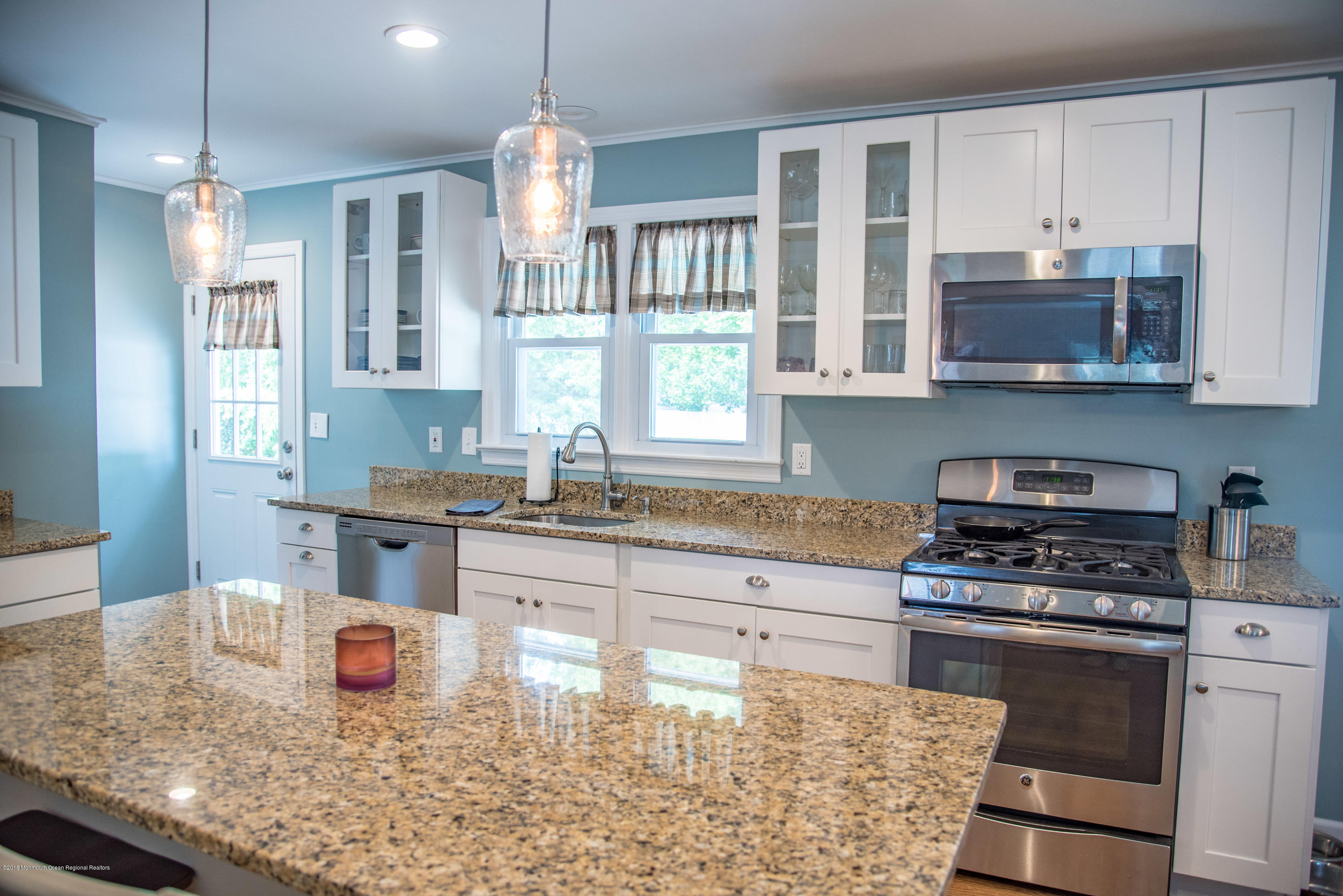 813 Beaver Dam Road Point Pleasant, NJ 08742 - Photo 7 of 27 a kitchen with stainless steel appliances granite countertop a stove a sink and a granite counter tops