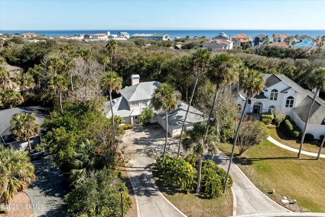 an aerial view of residential house with outdoor space and swimming pool
