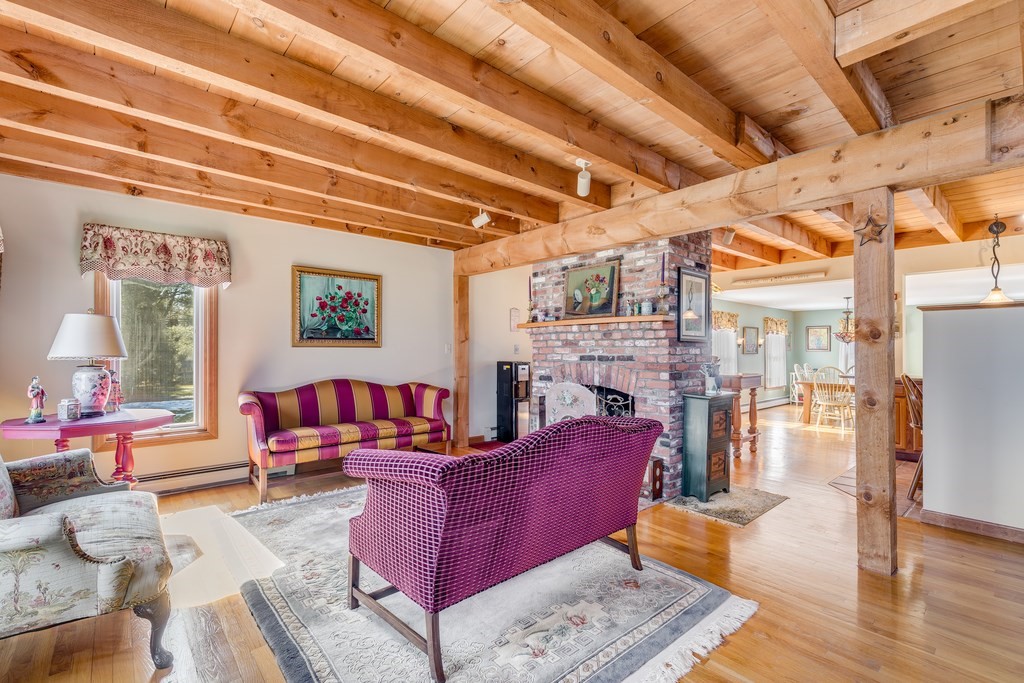450 Main Street Rowley, MA 01969 - Photo 14 of 27 a living room with furniture and a fireplace