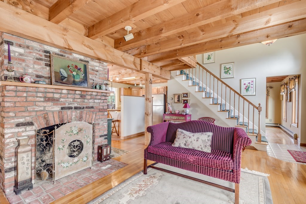 450 Main Street Rowley, MA 01969 - Photo 15 of 27 a living room with furniture and a fireplace