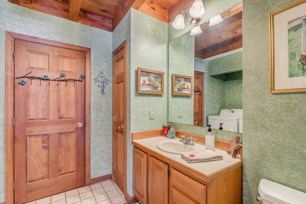 450 Main Street Rowley, MA 01969 - Photo 17 of 27 a bathroom with a sink and a mirror
