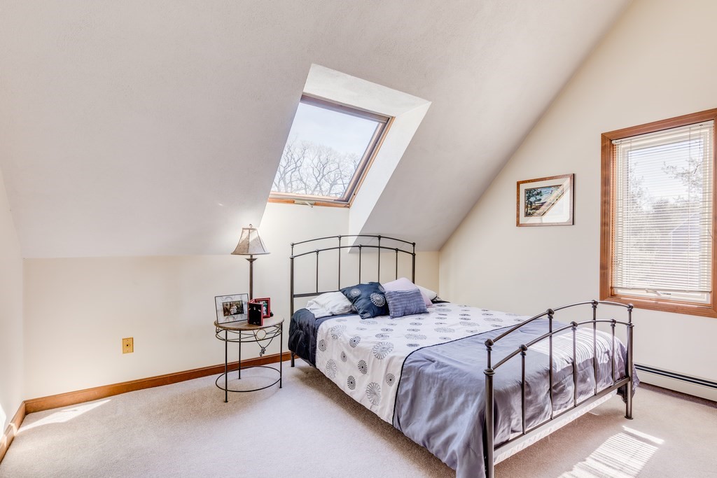 450 Main Street Rowley, MA 01969 - Photo 18 of 27 a bedroom with a bed and a window