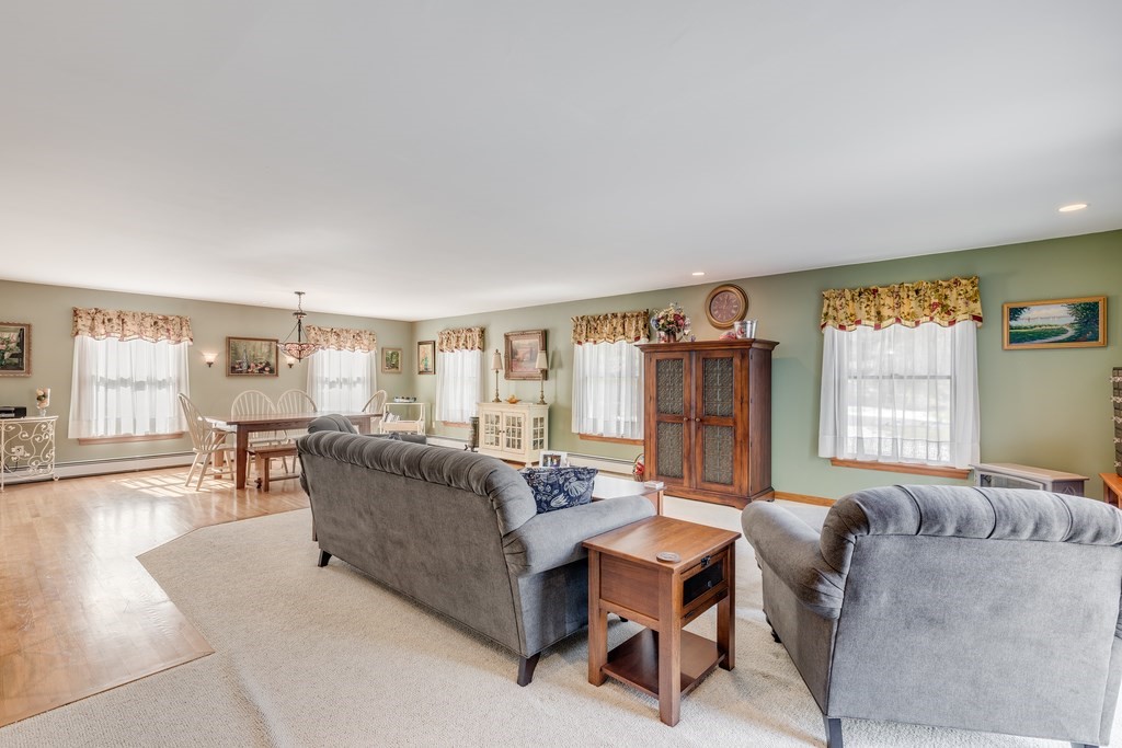 450 Main Street Rowley, MA 01969 - Photo 8 of 27 a living room with furniture and a large window
