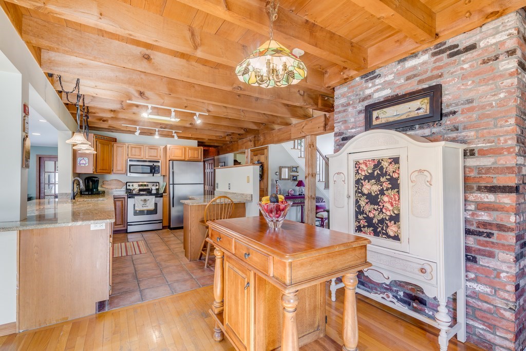 450 Main Street Rowley, MA 01969 - Photo 9 of 27 a view of a kitchen with furniture and a kitchen view