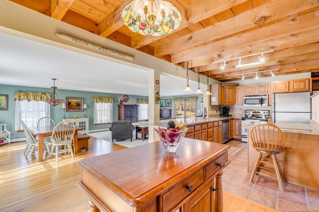 450 Main Street Rowley, MA 01969 - Photo 10 of 27 a view of a dining hall with couches and wooden floor