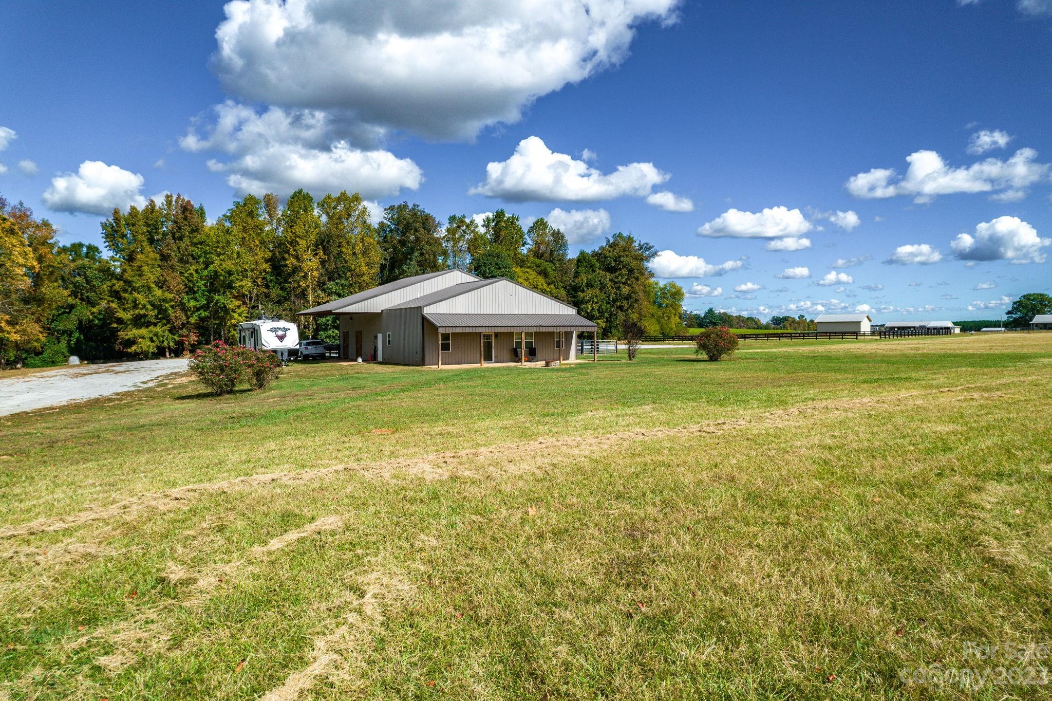340 Foster Road Cleveland, NC 27013 - Photo 1 of 44 a view of an house with swimming pool yard and outdoor seating