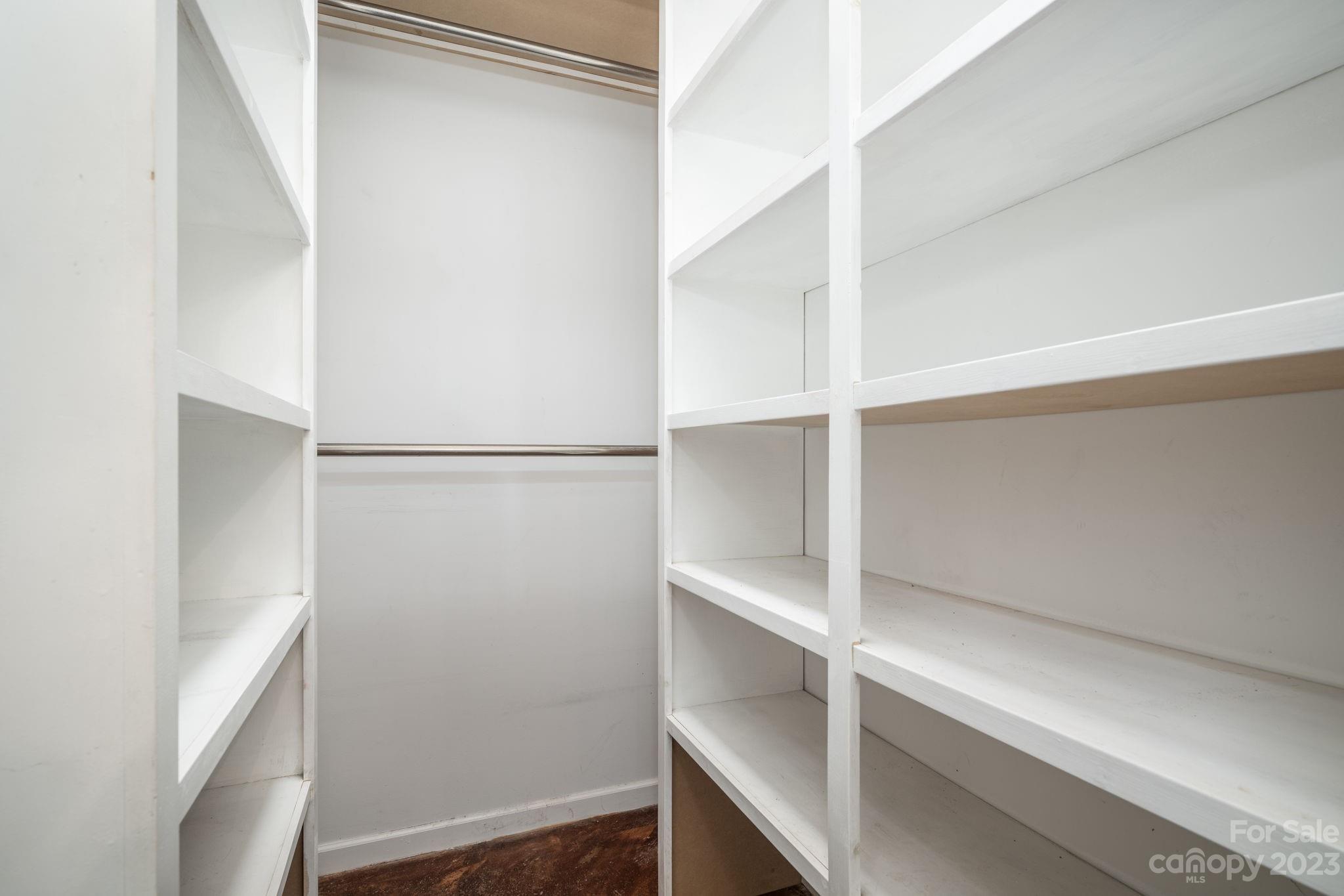 340 Foster Road Cleveland, NC 27013 - Photo 12 of 44 a view of walk in closet with empty racks
