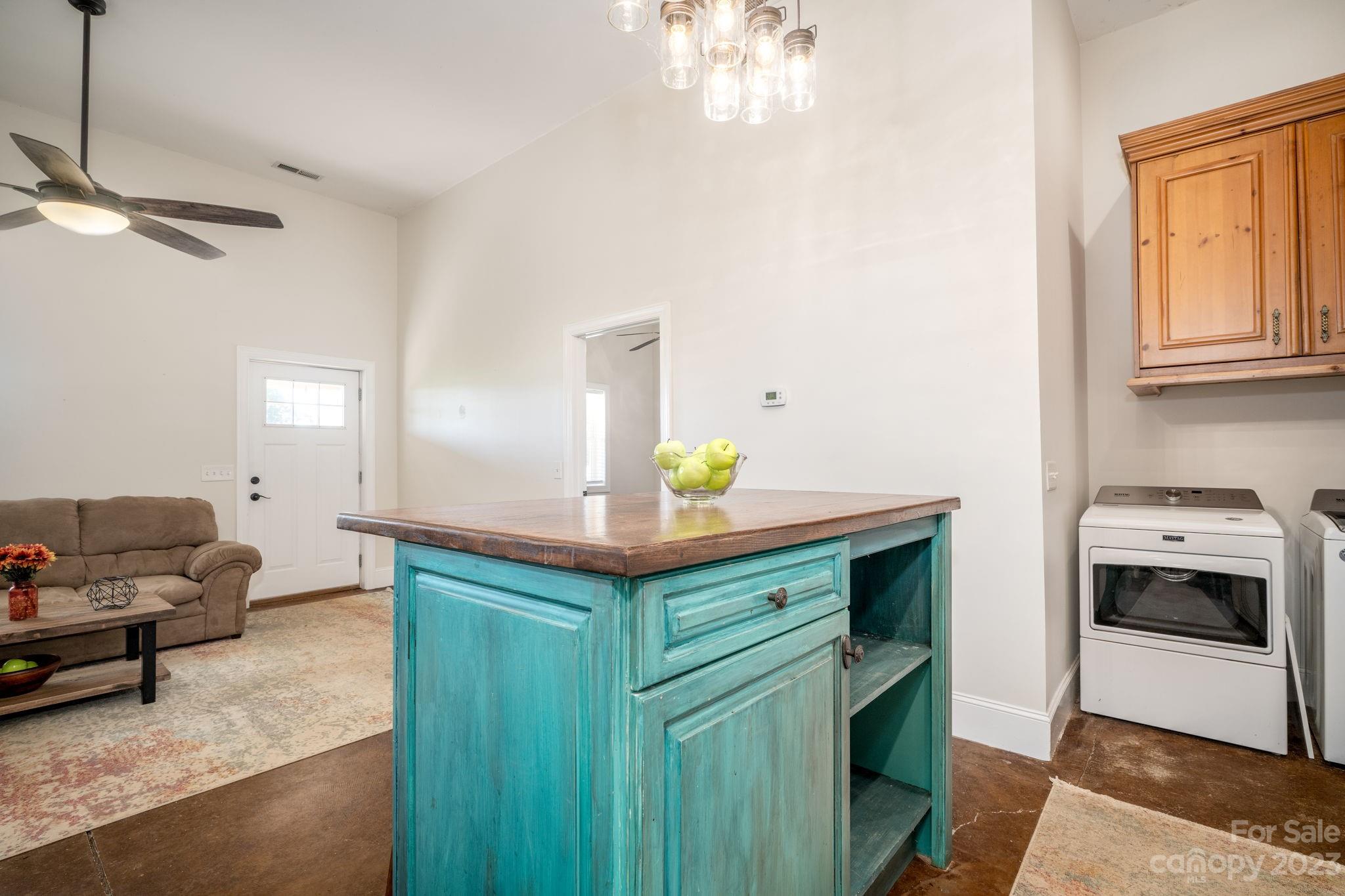 340 Foster Road Cleveland, NC 27013 - Photo 18 of 44 a kitchen with stainless steel appliances granite countertop a sink a stove and a wooden floors