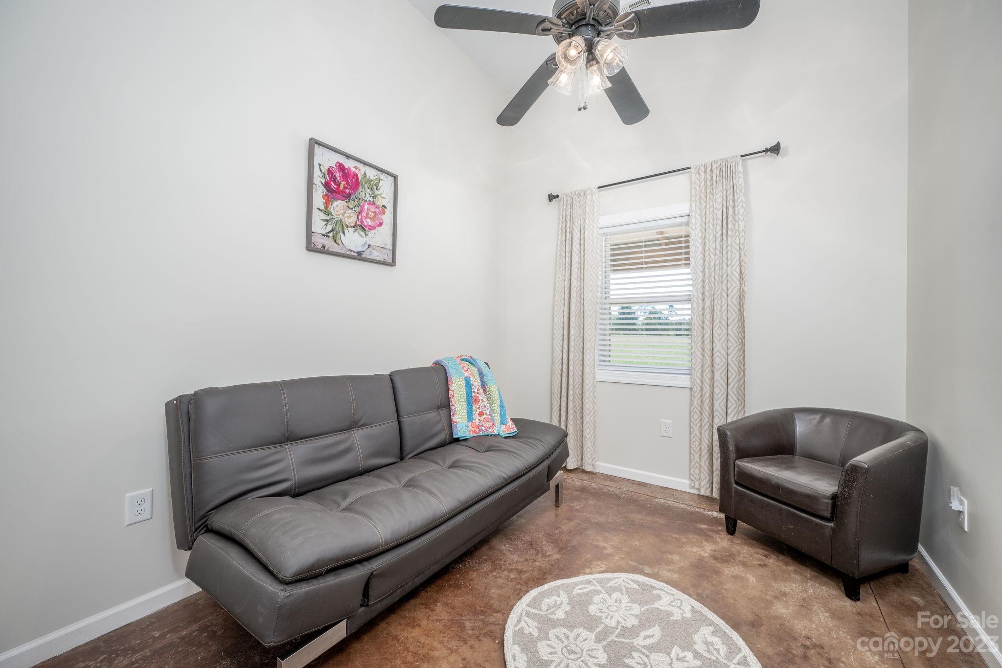 340 Foster Road Cleveland, NC 27013 - Photo 24 of 44 a living room with furniture and a window