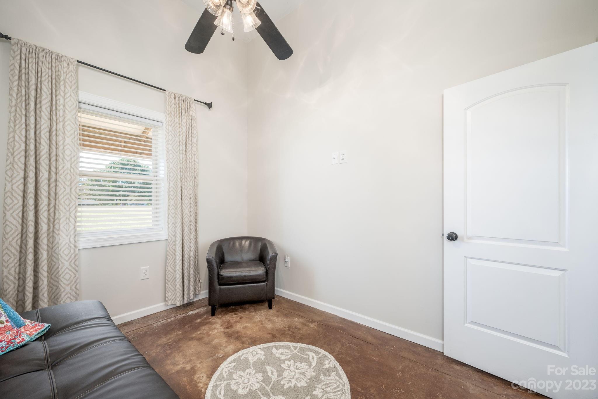 340 Foster Road Cleveland, NC 27013 - Photo 25 of 44 a living room with furniture and a window