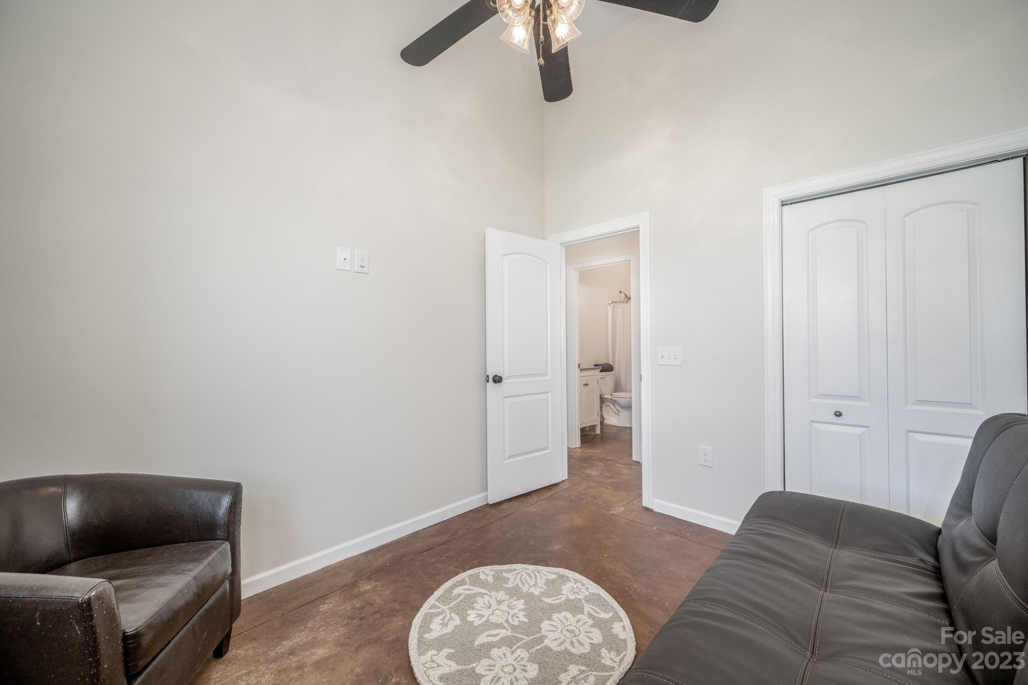 340 Foster Road Cleveland, NC 27013 - Photo 26 of 44 a living room with furniture and a chair