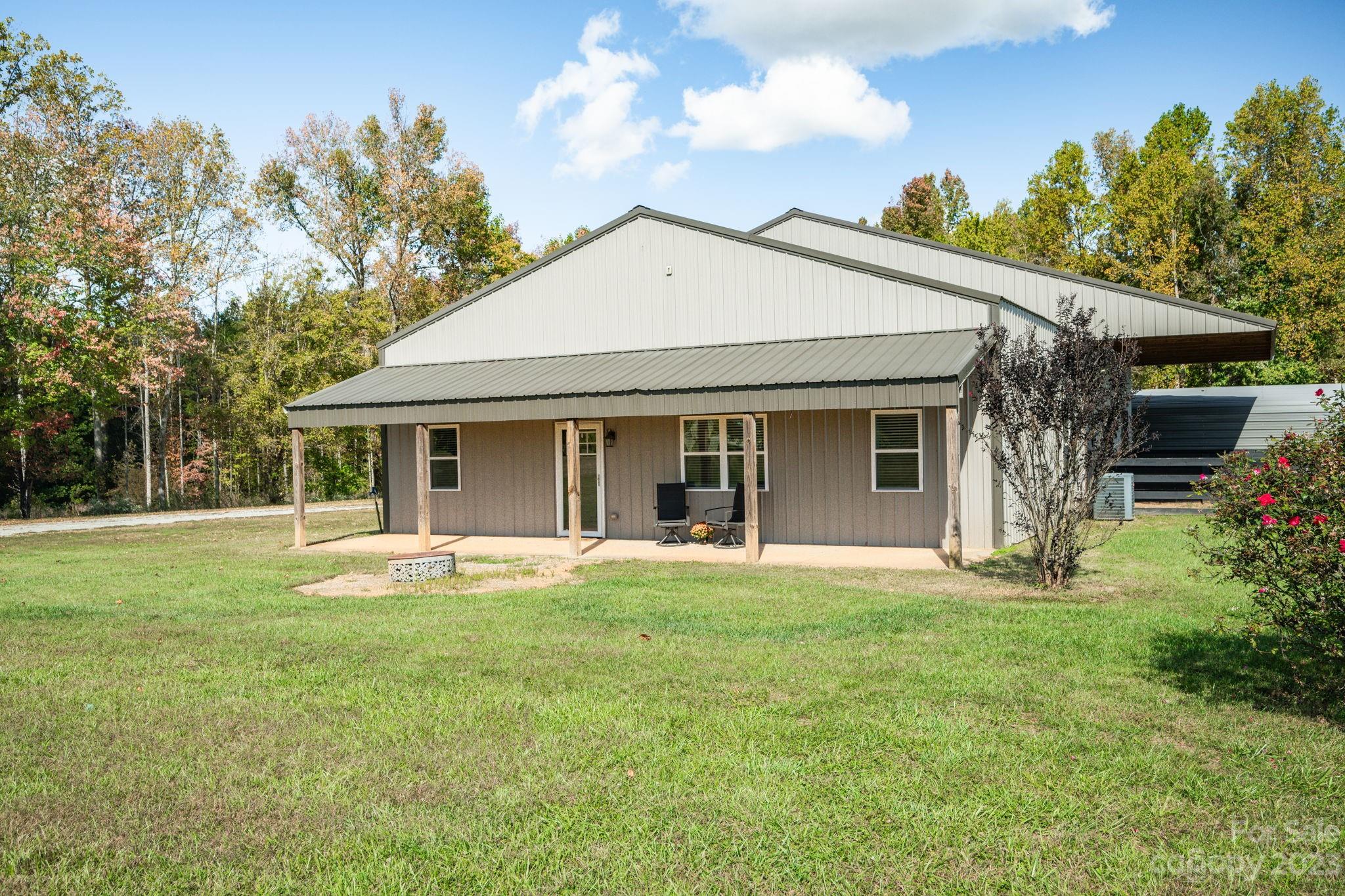 340 Foster Road Cleveland, NC 27013 - Photo 3 of 44 a front view of a house with a garden