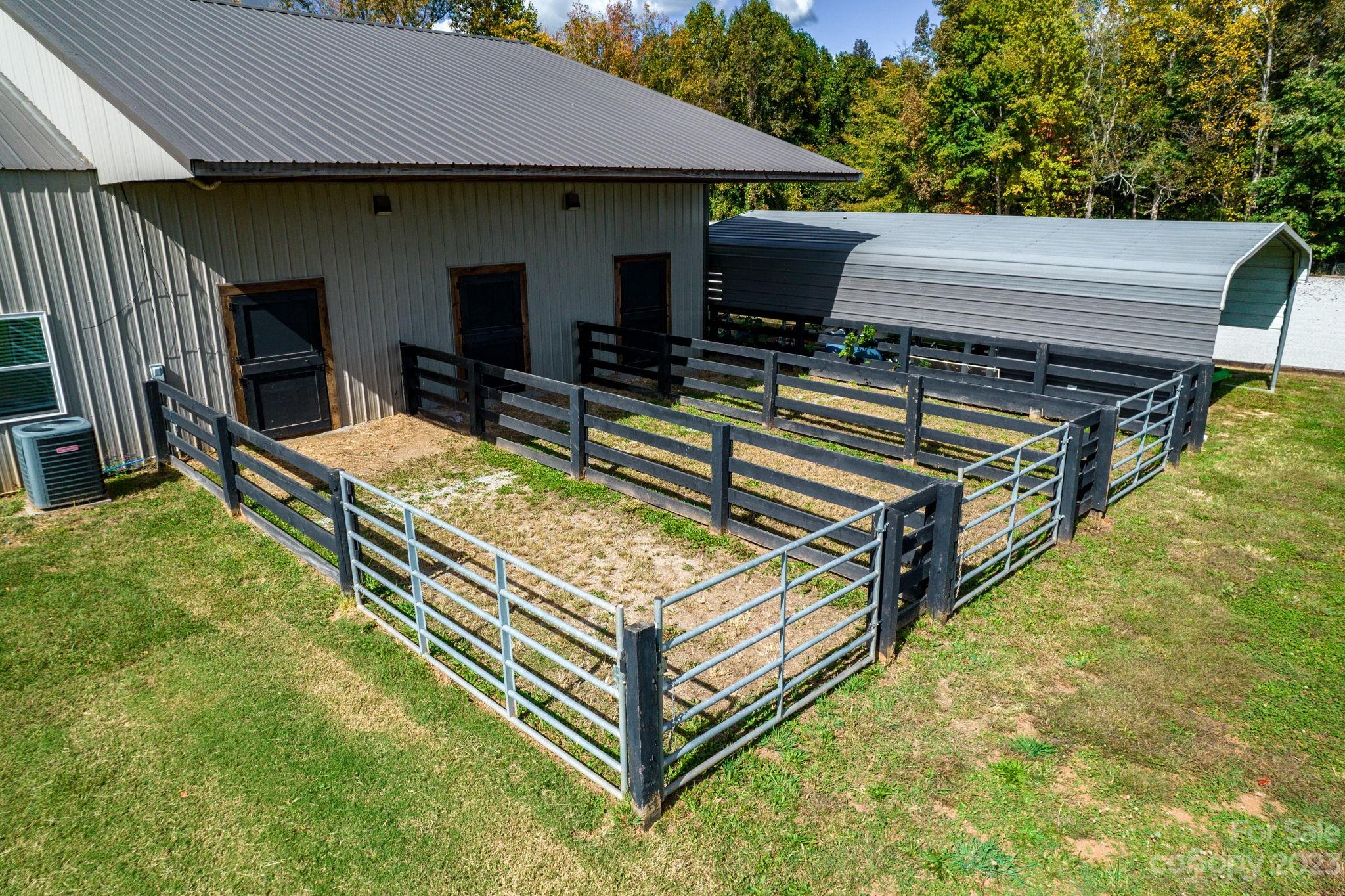340 Foster Road Cleveland, NC 27013 - Photo 35 of 44 a view of a backyard with chairs and a barbeque