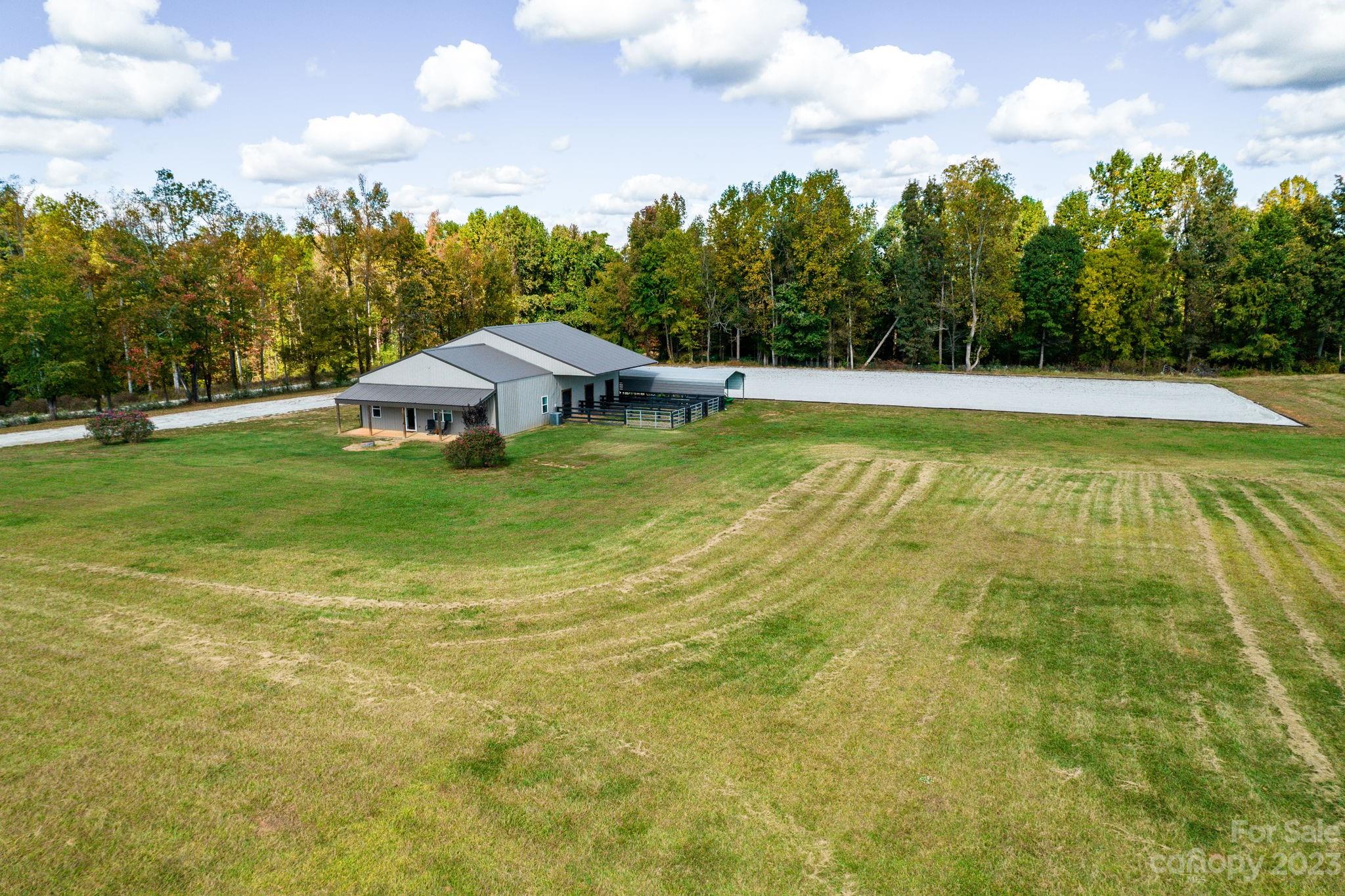 340 Foster Road Cleveland, NC 27013 - Photo 41 of 44 a view of a swimming pool with an outdoor space and seating area