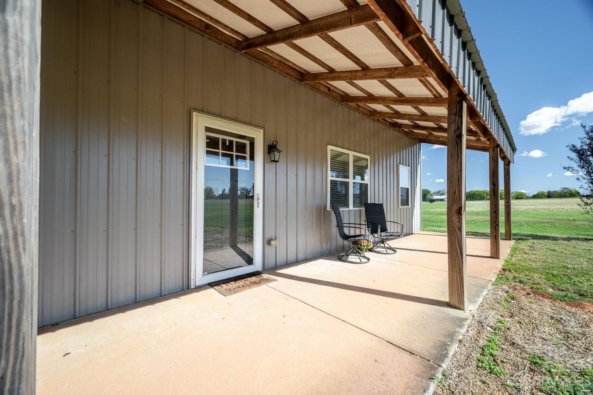 340 Foster Road Cleveland, NC 27013 - Photo 5 of 44 a view of a porch with wooden floor