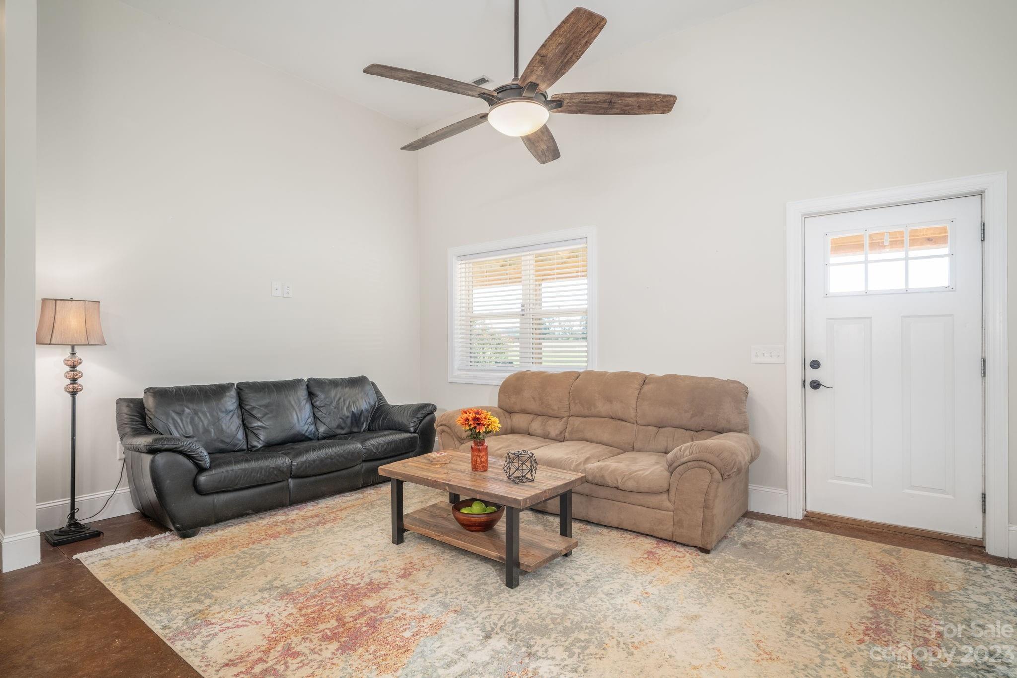 340 Foster Road Cleveland, NC 27013 - Photo 7 of 44 a living room with furniture and a window
