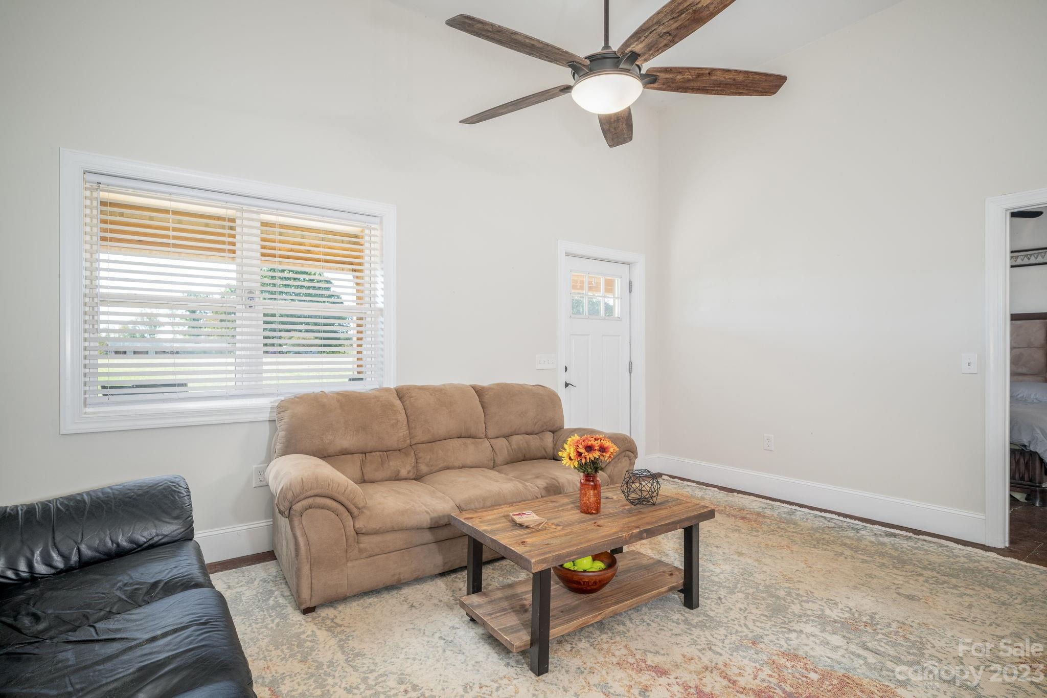 340 Foster Road Cleveland, NC 27013 - Photo 8 of 44 a living room with furniture and a window