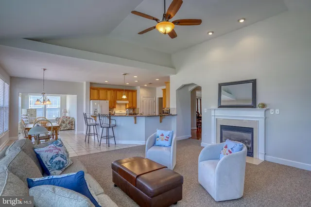 a large kitchen with stainless steel appliances granite countertop a sink stove and cabinets