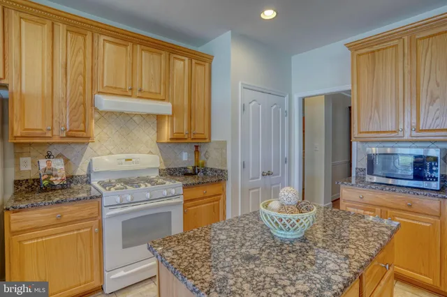 a living room with furniture and large windows