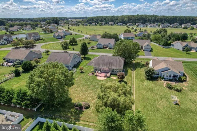 an aerial view of a house with swimming pool garden view and a garden