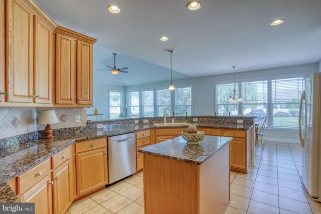 a bedroom with a bed and chandelier